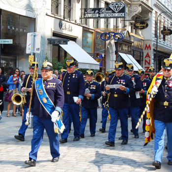 The Hoch- und Deutschmeisterkapelle marching through Vienna to hold one of their concerts.