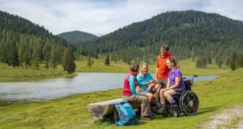 A family with a wheel cahir user in the Austrian Alps